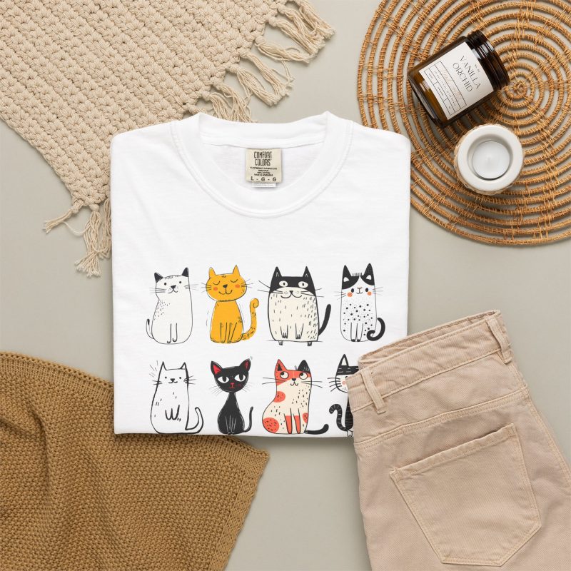 Eight line-drawn cats with assorted coat patterns above Purrfect Love lettering in the front print