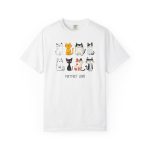 Front of the tee showing eight line-drawn cats in two rows with different expressions and coat patterns