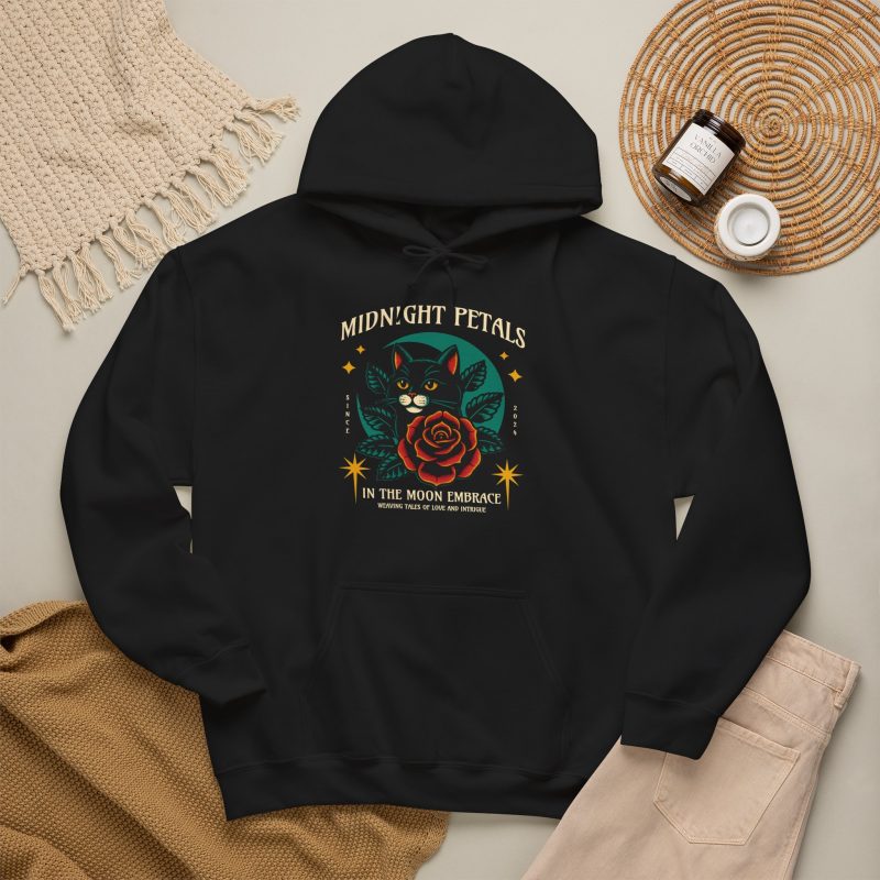 Detail of the black cat with a red rose and golden stars graphic on the hoodie