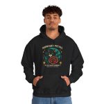 Person wearing a hoodie with a black cat with a red rose and golden stars graphic on the front