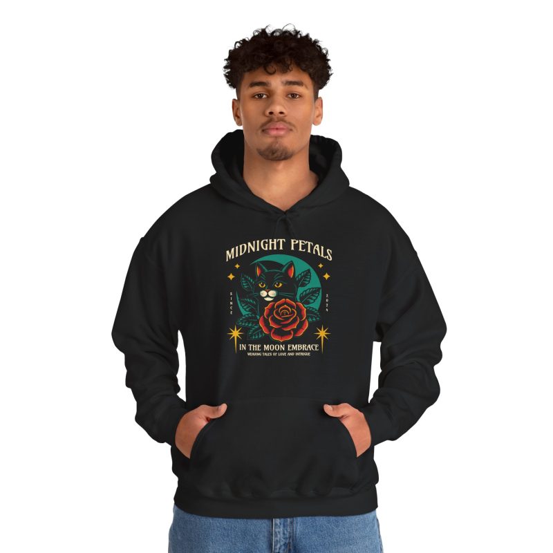Person wearing a hoodie with a black cat with a red rose and golden stars graphic on the front