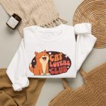 Smiling orange tabby, cream hearts and starbursts inside a retro Cat Lovers Club badge in the front print
