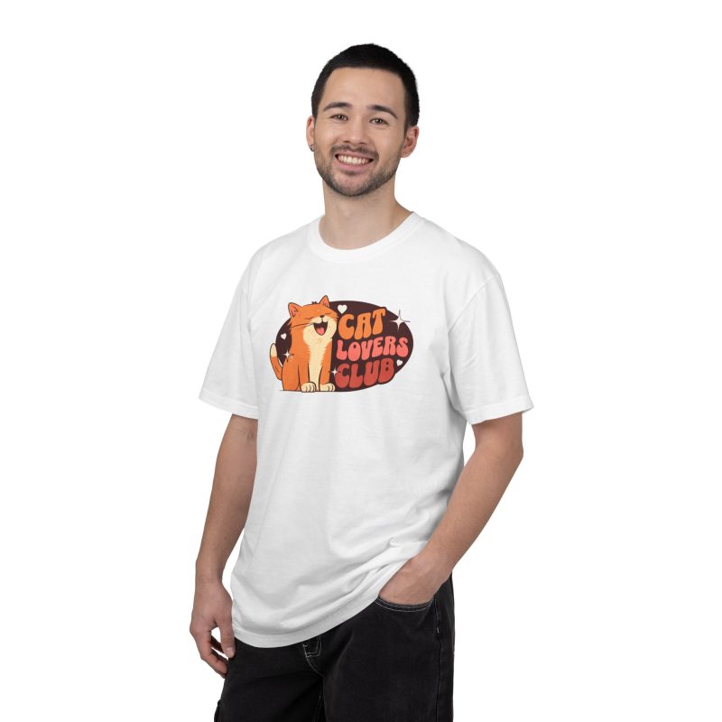 Person wearing a tee with a smiling orange tabby beside retro lettering in an oval badge with hearts and starbursts printed on the front