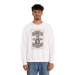 Person wearing a sweatshirt with an ornate grinning cat label Person wearing a sweatshirt with an ornate grinning cat label