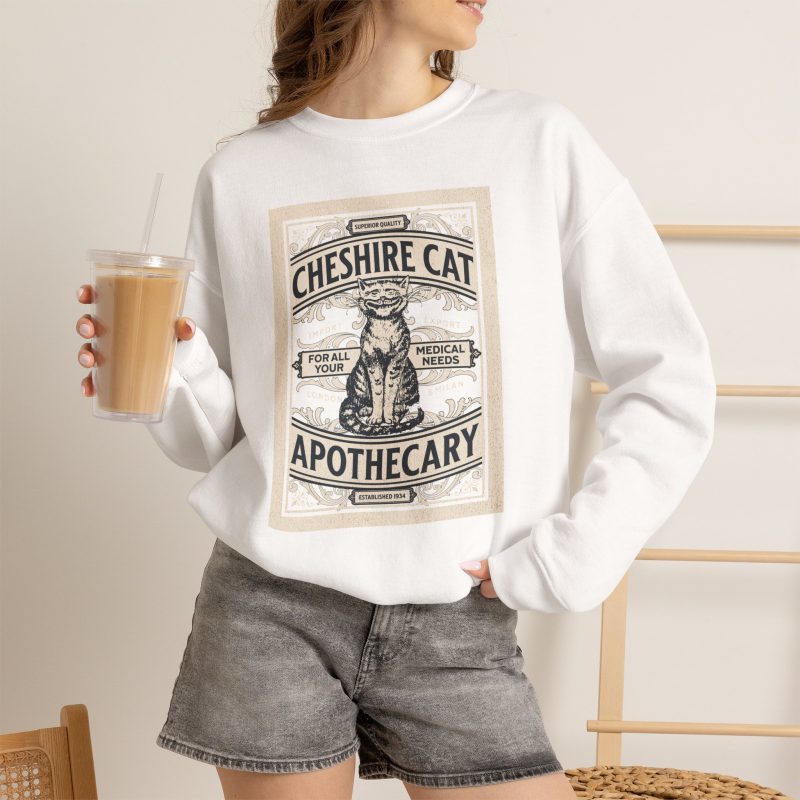 Person wearing a sweatshirt with an ornate grinning cat label