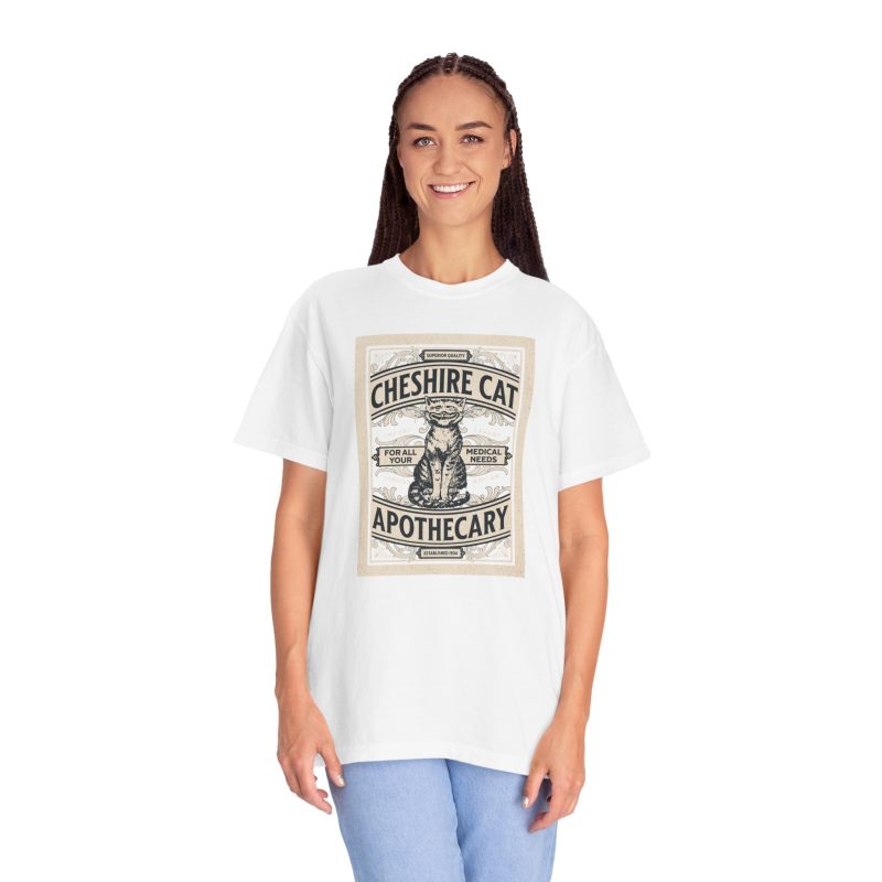 Person wearing a shirt with an ornate grinning cat label