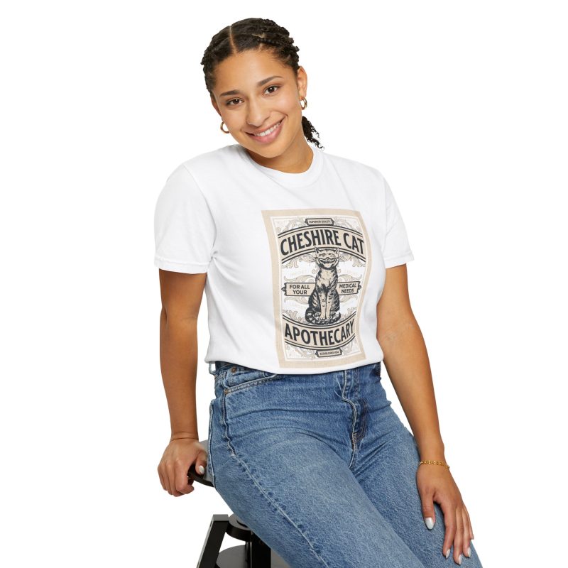Person wearing a shirt with an ornate grinning cat label