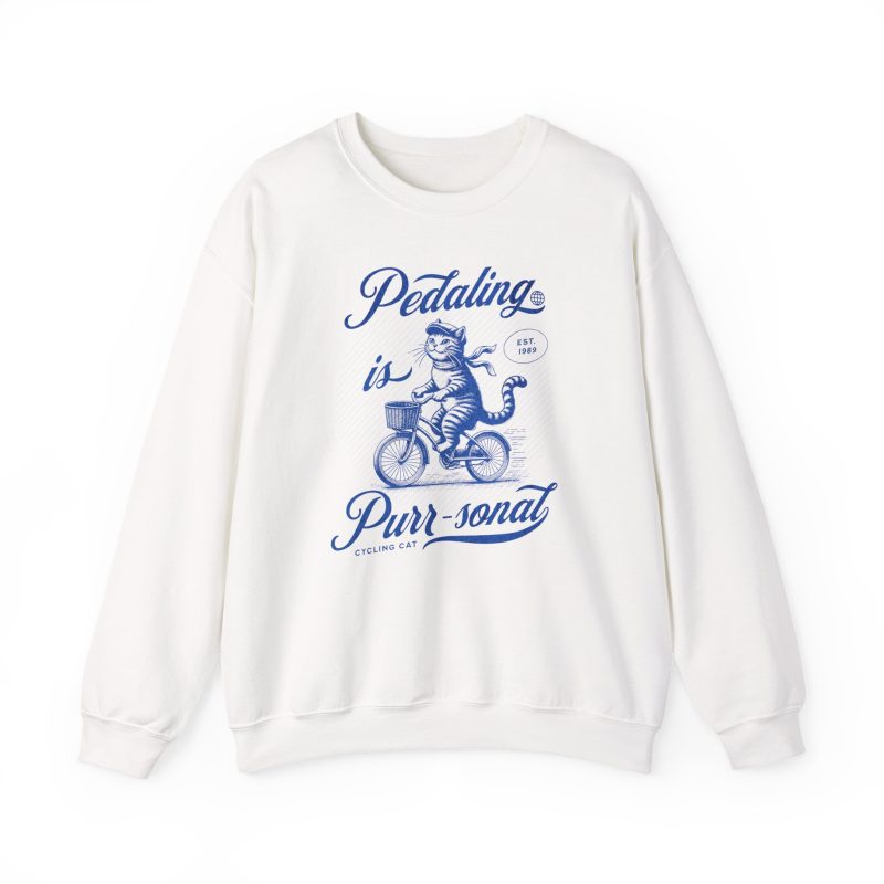 A blue tabby riding a bicycle with a basket printed on the front of a sweatshirt
