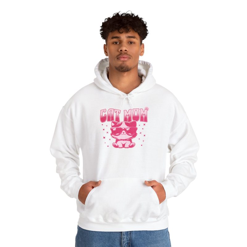 Person wearing a hoodie with a seated kitten in oversized sunglasses with pink striped lettering and stars printed on the front