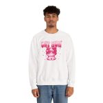 Person wearing a crewneck sweatshirt with a seated kitten in oversized sunglasses with pink striped lettering and stars printed on the front