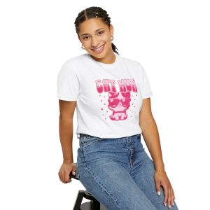 Person wearing a tee with a seated kitten in oversized sunglasses with pink striped lettering and stars printed on the front