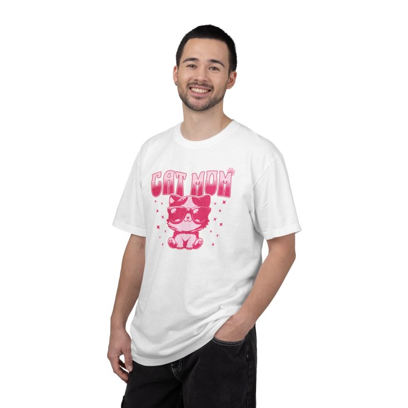 Person wearing a tee with a seated kitten in oversized sunglasses with pink striped lettering and stars printed on the front