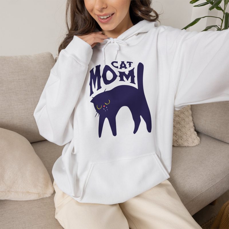 Person wearing a hoodie with a navy arched cat and wavy lettering graphic on the front