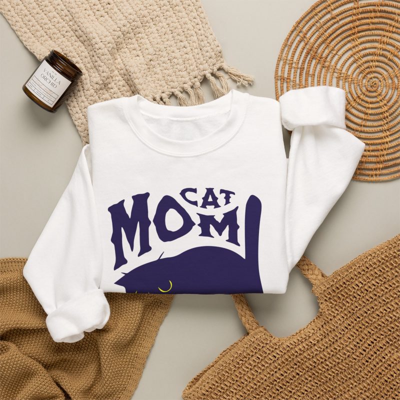Detail of the navy arched cat and wavy lettering graphic on the crewneck sweatshirt