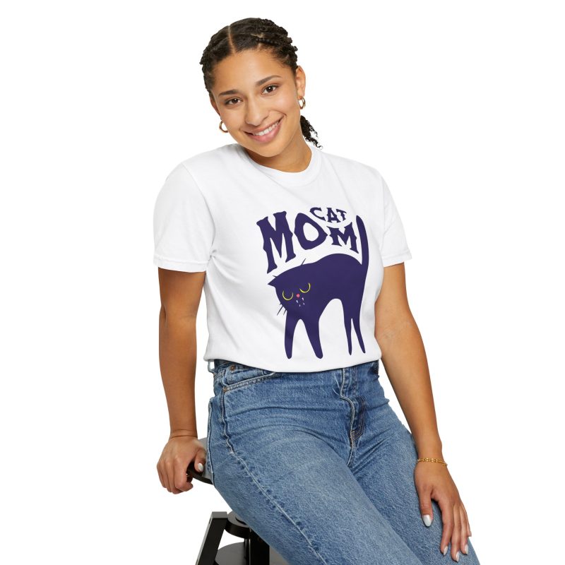 Person wearing a tee with a navy arched cat and wavy lettering graphic on the front