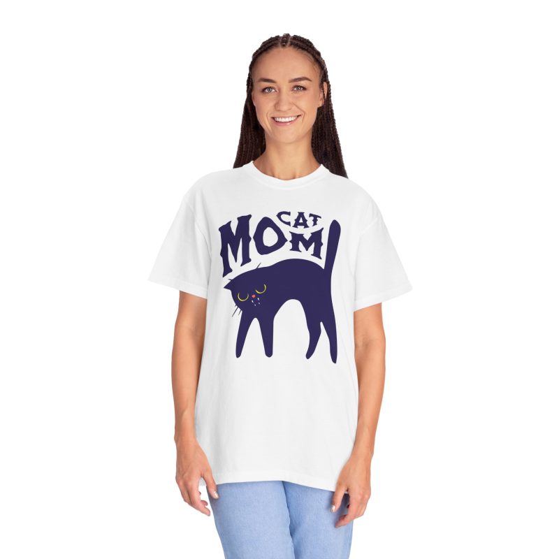 Person wearing a tee with a navy arched cat and wavy lettering graphic on the front
