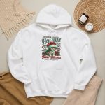 Detail of the Santa-hat kitten with holly and an ornament graphic on the hoodie