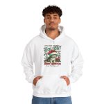 Person wearing a hoodie with a Santa-hat kitten with holly and an ornament graphic on the front