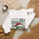 Detail of the Santa-hat kitten with holly and an ornament graphic on the crewneck sweatshirt