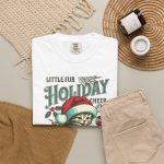 Detail of the Santa-hat kitten with holly and an ornament graphic on the tee
