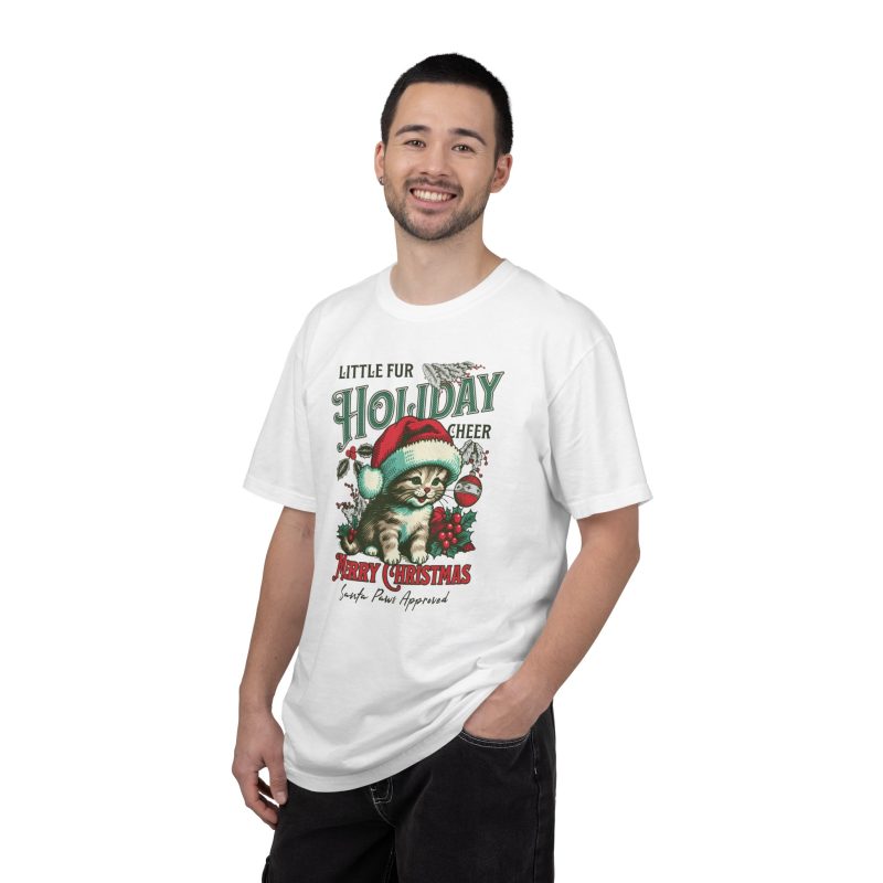 Person wearing a tee with a Santa-hat kitten with holly and an ornament graphic on the front