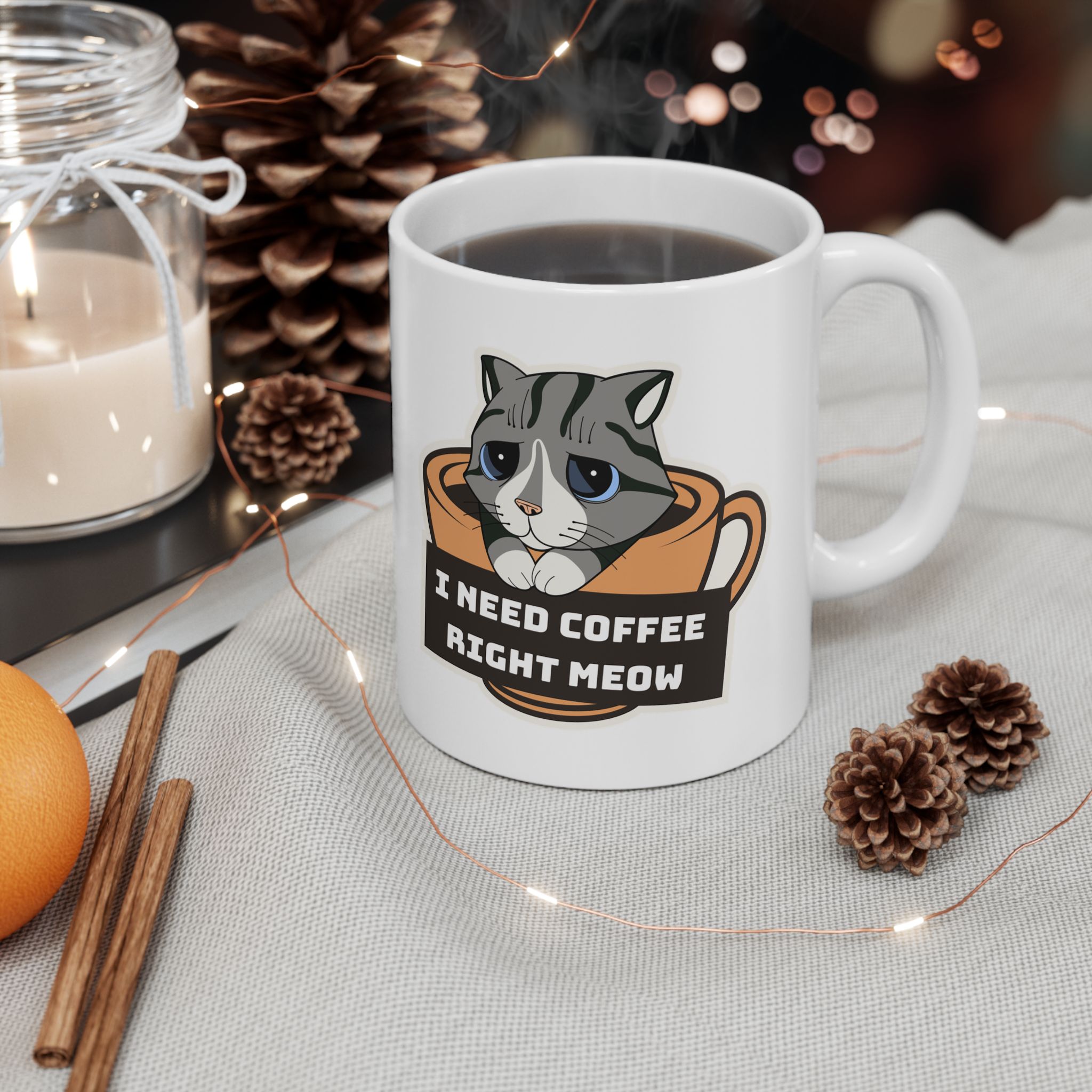 White ceramic mug showing the gray tabby in an orange coffee cup graphic