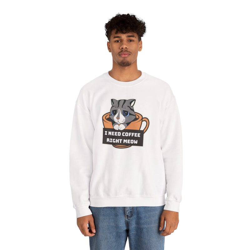 Person wearing a crewneck sweatshirt with a gray tabby in an orange coffee cup graphic on the front