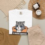 Detail of the gray tabby in an orange coffee cup graphic on the tee Detail of the gray tabby in an orange coffee cup graphic on the tee