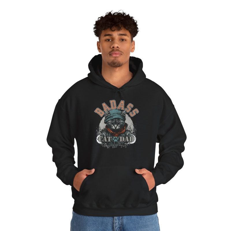 Person wearing a hoodie with a tabby in a cap, jacket and scarf graphic on the front