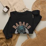 Detail of the tabby in a cap, jacket and scarf graphic on the crewneck sweatshirt