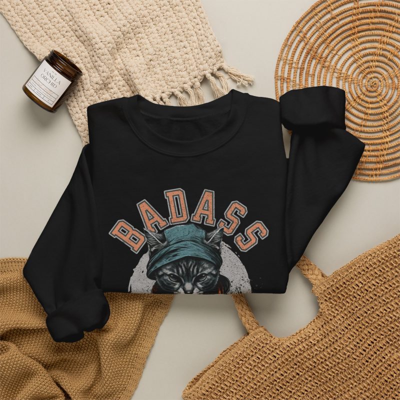 Detail of the tabby in a cap, jacket and scarf graphic on the crewneck sweatshirt