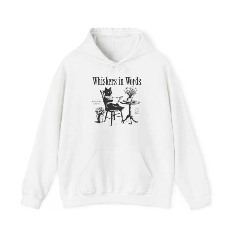 Front of the hoodie showing the cat reading a book at a café table graphic