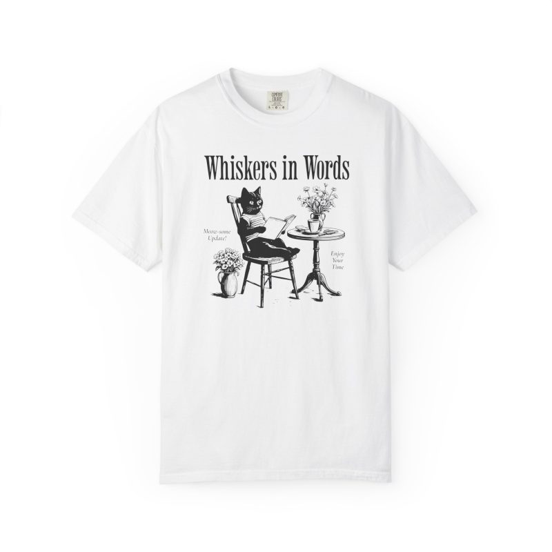 Front of the tee showing the cat reading a book at a café table graphic