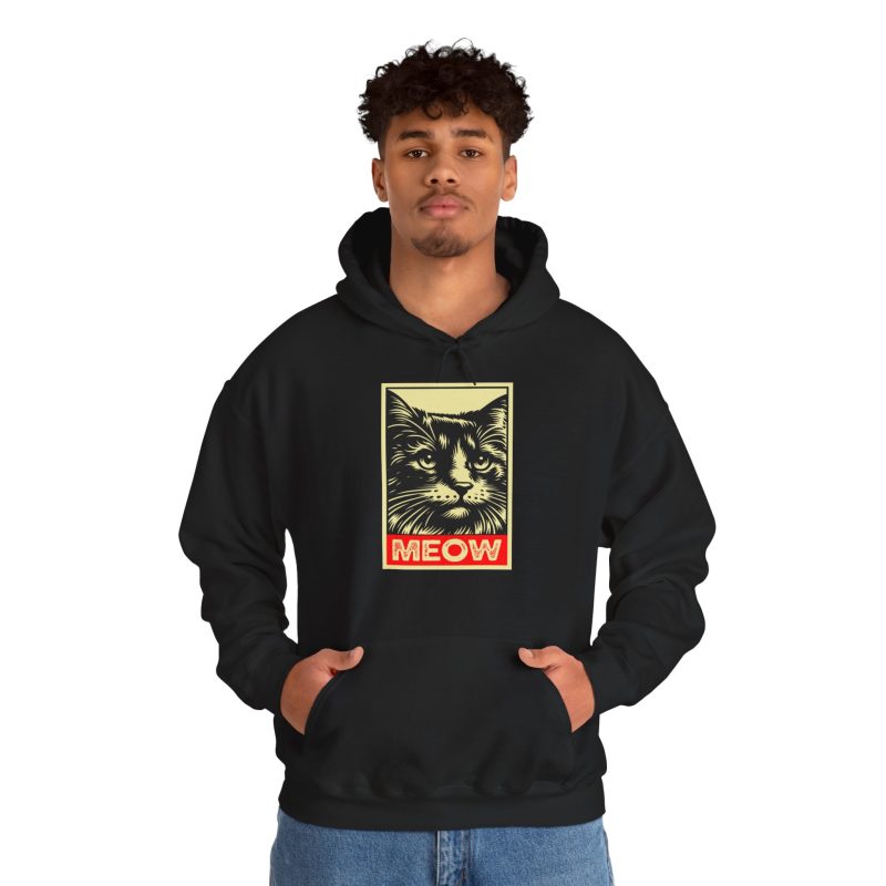 Person wearing a hoodie with a bold cat portrait and red panel