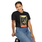 Person wearing a shirt with a bold cat portrait and red panel Person wearing a shirt with a bold cat portrait and red panel