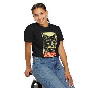 Person wearing a shirt with a bold cat portrait and red panel