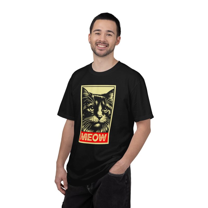Person wearing a shirt with a bold cat portrait and red panel