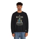 Person wearing a sweatshirt with crosswalk kittens